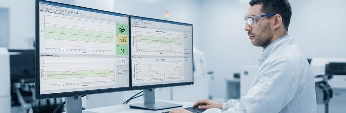 Quality engineer analyzing SPC charts